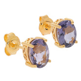 Oval purple sapphire sterling silver earrings with gold accents, showcasing luxury and elegance in jewelry.